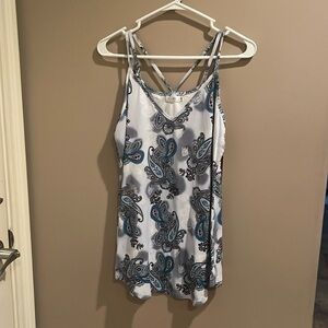 Never been worn, spaghetti strap blouse, criss cross straps in back size medium